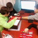 tags/children playing with robotics in a Greek NGO